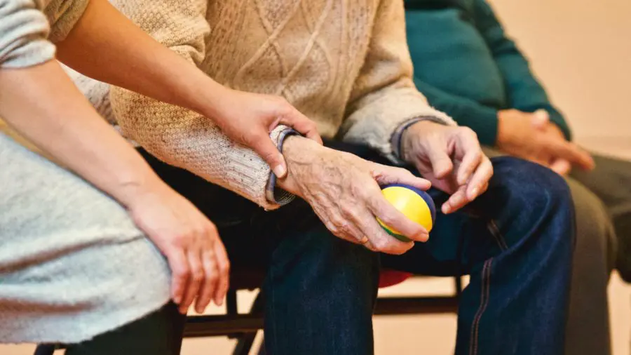 elderly man taking part in an activity