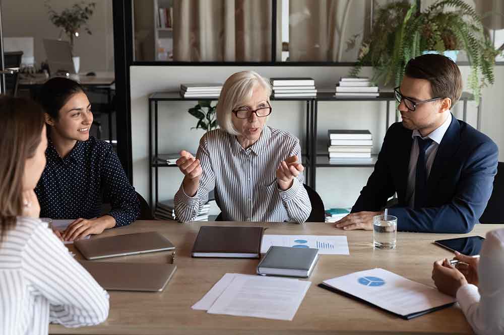 People sitting around a table having a meeting