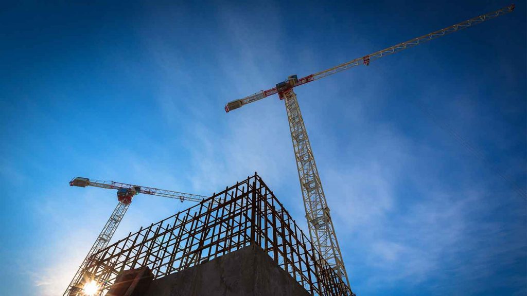 A crane standing above a building site