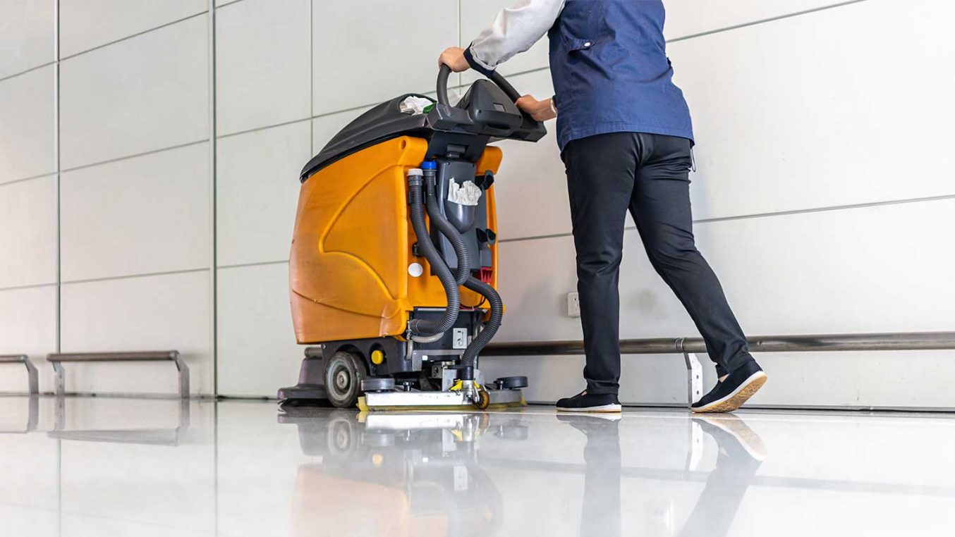 A floor being cleaned by a large machine