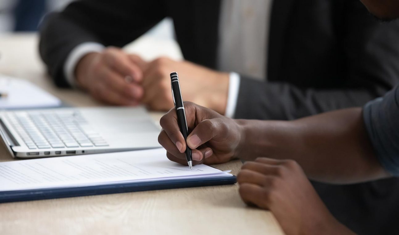 A person signing a contract