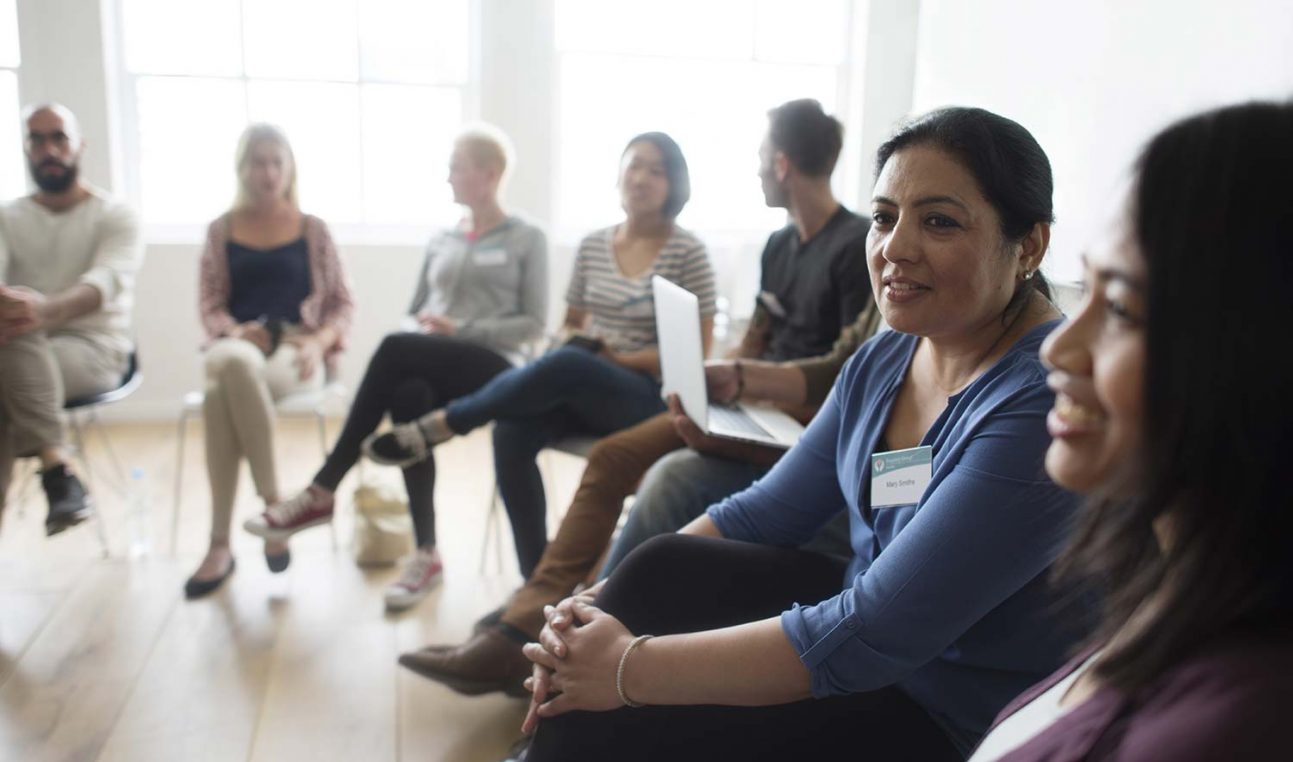 People sitting in a circle having a discussion