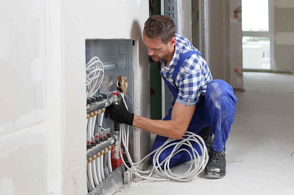 A person servicing a gas installation