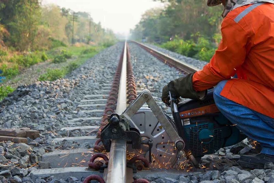 A railway line being built using a metal power tool