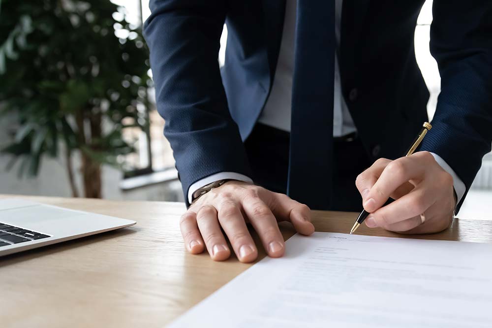 A person signing a contract